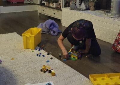 Young child playing with legos